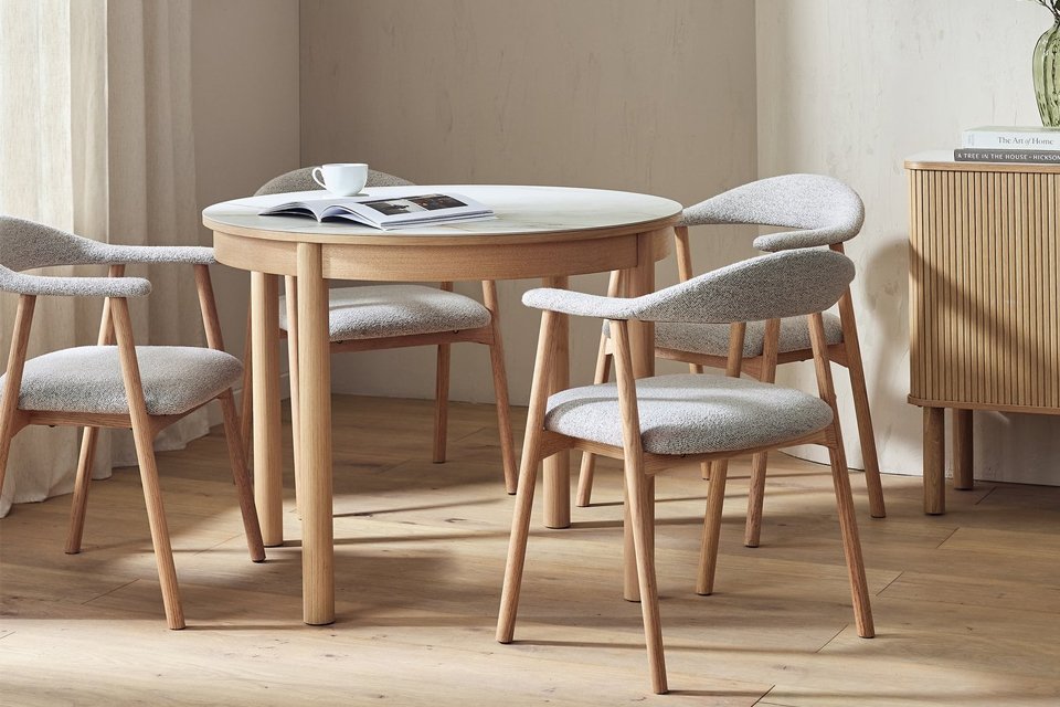 A Habitat Lex round table and 4 Lex natural chairs.